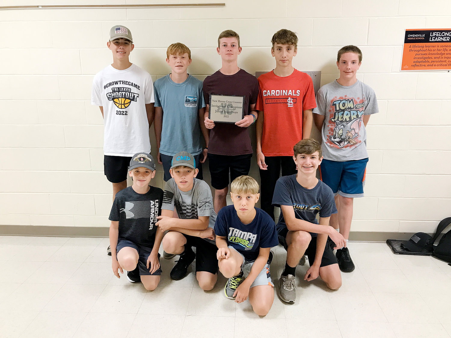 OMS Dutchmen cross country team members (in front, from left) gathering Tuesday morning for a picture with their championship plaque from New Haven include Aaiden Cox, Drake Dietrich, Shane Fudge and Maddix Lebish; and in back, Bryce Kramme, Kylen Menz, Zach Holtmeyer, Braden Perkins and Elliott Cooper. Not pictured but also competing at New Haven for OMS’ Dutchmen were Granite Miles, Corbin Brand, Zayden Garver, Nick Hinson and Ethan Blankenship.